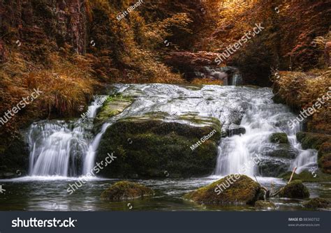 Stunning Waterfall In Beautiful Autumn Fall Colors Dense
