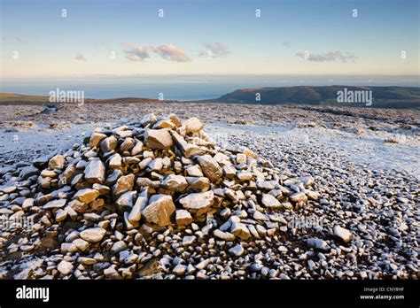 Stone Cairn At Dunkery Beacon On A Snowy Winters Morning Exmoor