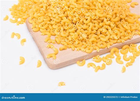 A Heap Of Uncooked Chifferi Rigati Pasta On Wooden Kitchen Board Stock