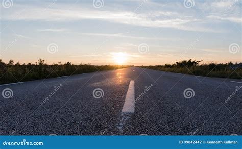Extreme Low Angle View At An Asphalt Road Stock Photo Image Of Sunset
