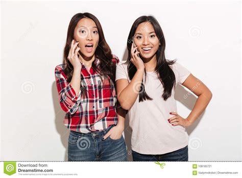 Women Sisters Talking By Their Mobile Phones Stock Image Image Of Cheerful Looking 108185721