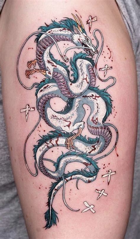 a dragon tattoo on the back of a woman s left arm with stars around it