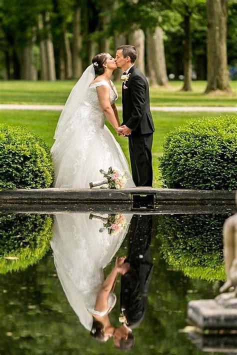 Wedding Photo Shoot Bride And Groom Reflection In A Water In The Garden