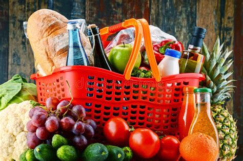 Plastic Shopping Basket With Assorted Grocery Products Stock Image