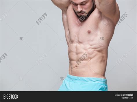 Strong Athletic Man Fitness Model Torso Showing Six Pack Abs Isolated On Grey Background With