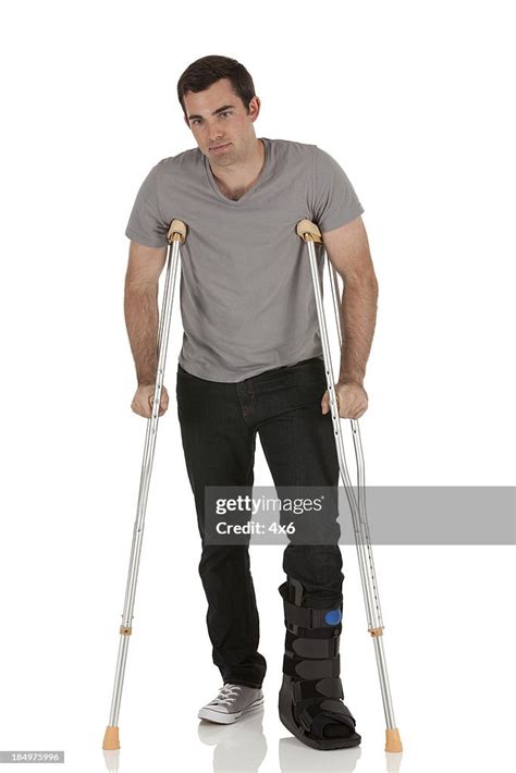 Injured Young Man On Crutches High Res Stock Photo Getty Images