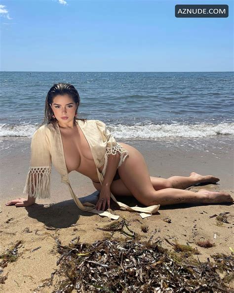 Demi Rose Sexy Poses Almost Topless In A Beach Photoshoot