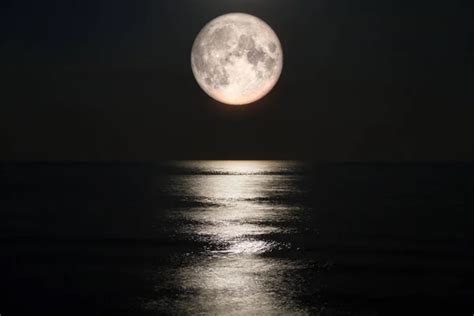 Moon Over Sea Stock Photo By ©gnomeandi 51250507
