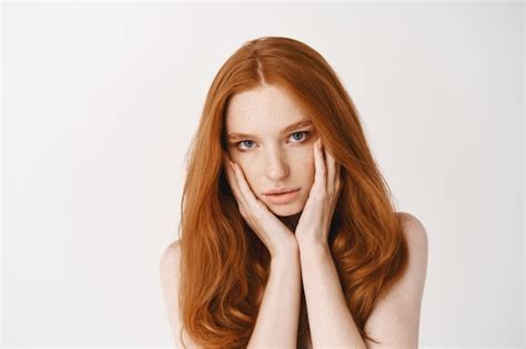 Free Photo Close Up Of Natural Young Woman With Ginger Hair Touching Pale Clean No Make Up