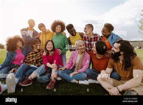 Group Of Young Multiracial Friends Having Fun Together In Park