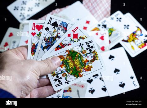 Playing Cards In Hand A Hand Holding Playing Cards Stock Photo Alamy