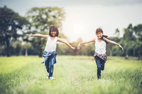 Two Little Girls Best Friends Holding Hands