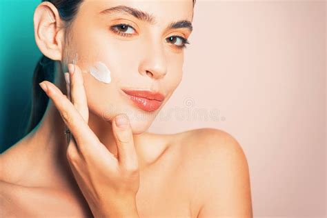 Beautiful Woman Spreading Cream On Her Face Skin Cream Concept Facial