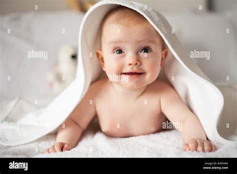 Baby Girl Is Hiding Under The White Blanket Stock Photo Alamy