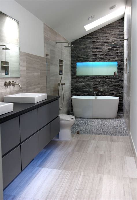 Modern Gray Bathroom Design With Striped Tile Floor And Brick Wall
