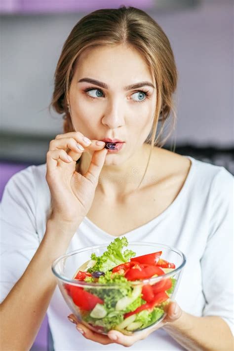 The Young Woman Eats Salad The Concept Is Healthy Food Diet V Stock