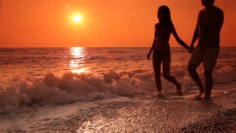 Loving Teen Couple Have Fun On The Beach At Sunset Stock Footage Video 3537494 Shutterstock