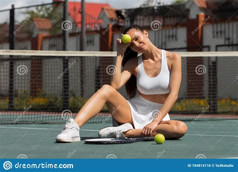 Alluring Adult Woman Sitting On Tennis Court In Sunlight Stock Photo Image Of Curve Female