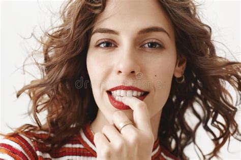 Close Up Shot Of Hot And Sensual European Woman With Curly Hair And Red Lisptic Gazing At