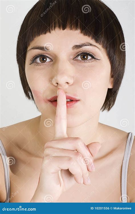 Pretty Girl Holding A Finger In The Mouth Showing Royalty Free Stock