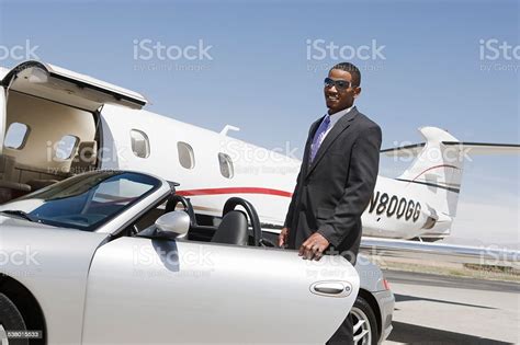 Africanamerican Businessman With Airplane Stock Photo Download Image