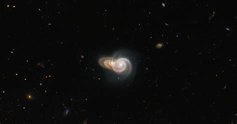 Hubble Captures Optical Illusion Of Two Spiral Galaxies Colliding