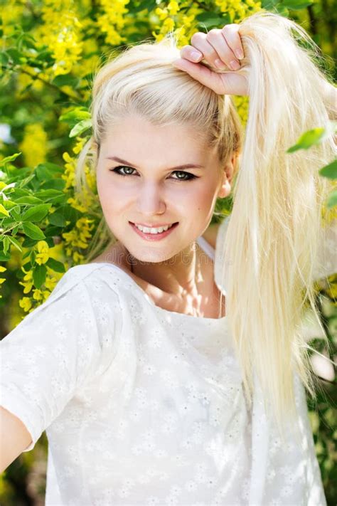 Beautiful Blonde Girl With Yellow Flowers Stock Photo Image Of
