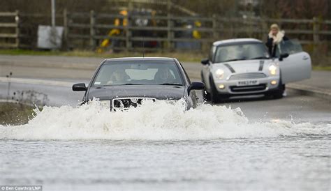 flooding now thousands more face evacuation as 14 severe weather warnings are issued for thames