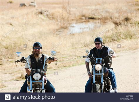 Two Young Men On Motorcycles Stock Photos And Two Young Men On