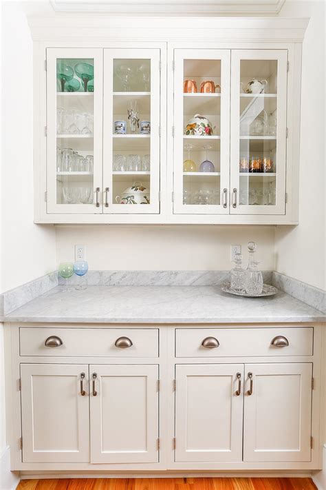 Pantry cabinets are not meant for food storage only. Luxury South Carolina Home features Inset Shaker Cabinets