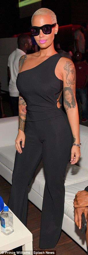 Amber Rose Displays Her Curvaceous Derriere In Skintight Black Jumpsuit