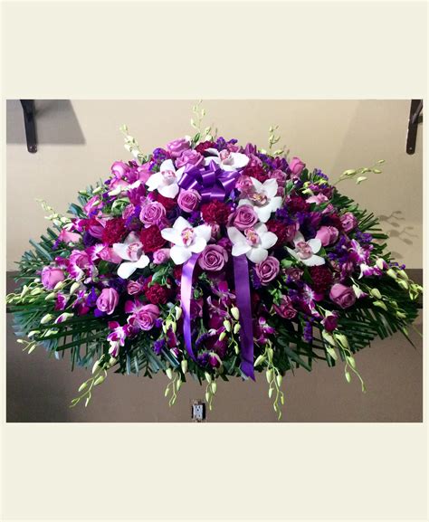 It came in a beautiful glass vase and it's absolutely beautiful! CS1460: Assorted Purple Casket Spray - Floral Fantasy US