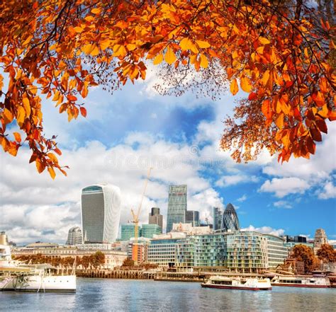 London With Modern City Against Autumn Leaves In England Uk Stock