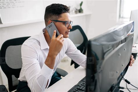 Man Talking On Mobile Phone In Office Stock Photo 146935 Youworkforthem