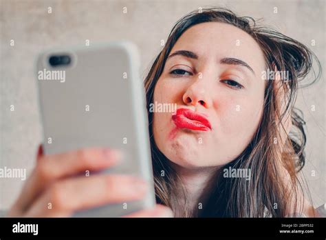 Drunk Girl With Smeared Lipstick Takes Selfie Pictures On The Phone