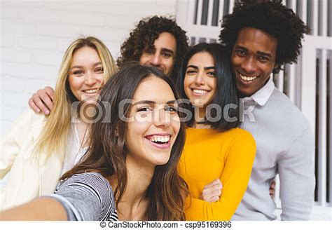 Multi Ethnic Group Of Friends Taking A Selfie Together While Having Fun Outdoors Multi Ethnic