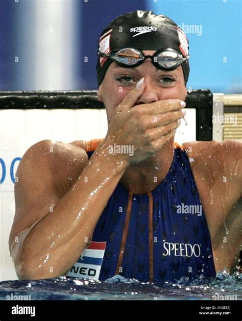 inge de bruijn of the netherlands reacts after winning gold in the 50 meter freestyleat the