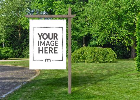 Large Yard Sign Mockup On Wooden Pole In Green Grass Mediamodifier