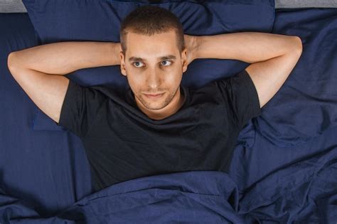 Premium Photo Top View Of A Handsome Young Man With Insomnia Having