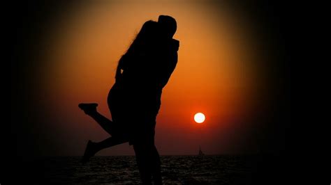 Silhouette Of A Couple Hugging In The Light Of Sunset Free Stock Video