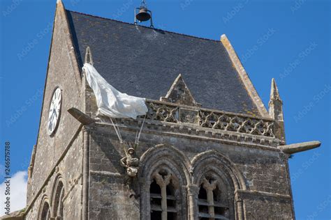 Historic Church Of Sainte Mere Leglise With A Paratrooper Hanging On