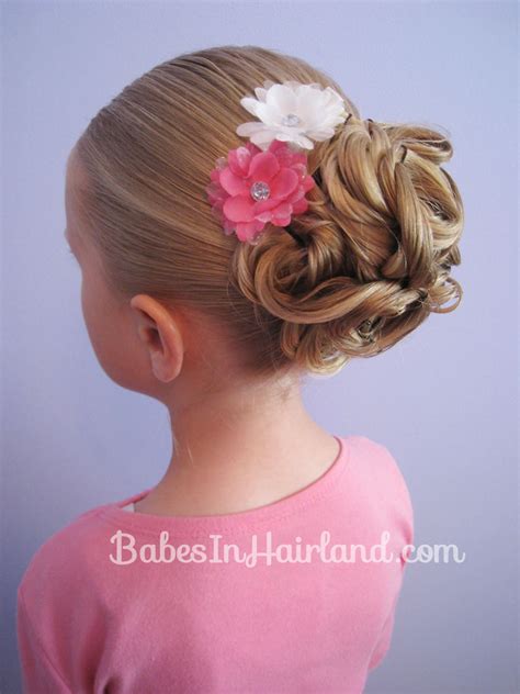 To all the moms, if you are looking for new hairstyles for a little one, then this fishtail half updo can be a good idea. Easy Looped Updo - Babes In Hairland
