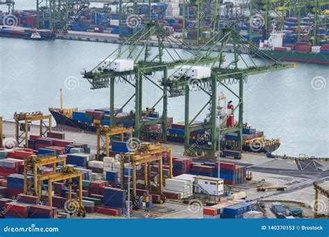 Commercial Port With Container Ships During Loading And Unloading Stock