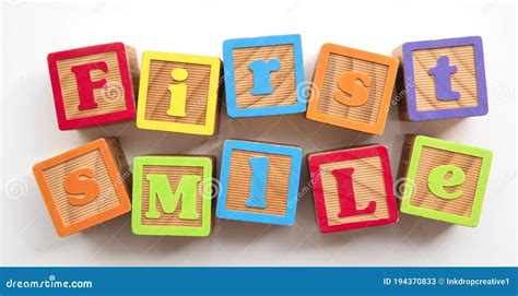 First Smile Word Made From Colourful Wooden Baby Development Blocks