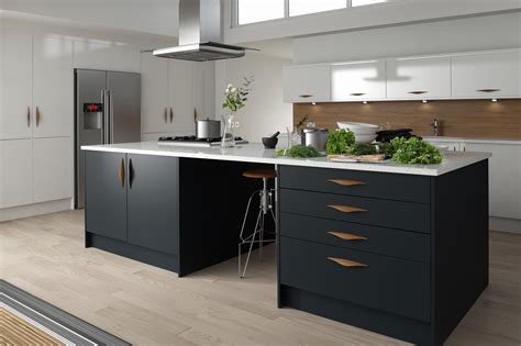 The grey of this kitchen island contrasts the bright white of the cupboards while the backsplash adds a bit of color to the room. grey matte kitchen with copper handles - Google Search ...