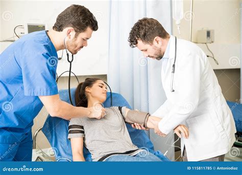 Team Of Doctors Treating Emergency Patient Stock Image Image Of Young