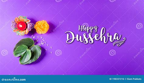 Happy Dussehra Yellow Flowers Green Leaf And Rice On Purple Pastel