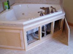 Originally it had three different tiles going on: Whirlpool Tub Surround Ideas | Tub Access Panel Design ...