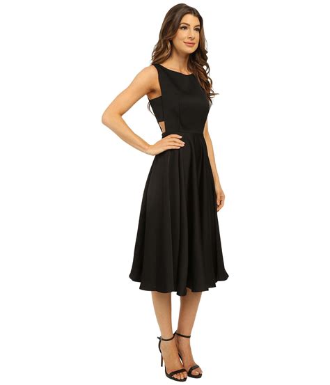 ﻿satin midi dress with side cut outs thin rouleau straps side cut outs open cowl back straight neckline full length skirt hook fastening on bandeau back designed + made in australia model stats: Ted Baker Lyxa Cut Out Full Skirt Midi Dress in Black - Lyst