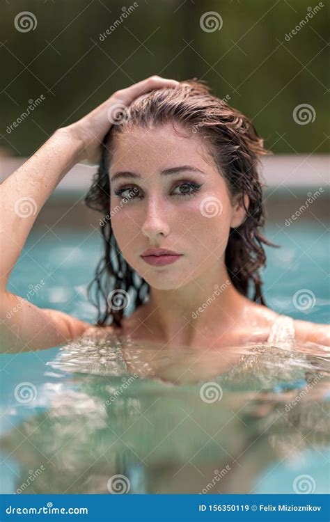 Bikini Model Posing In A Pool With Hand On Head Stock Image Image Of